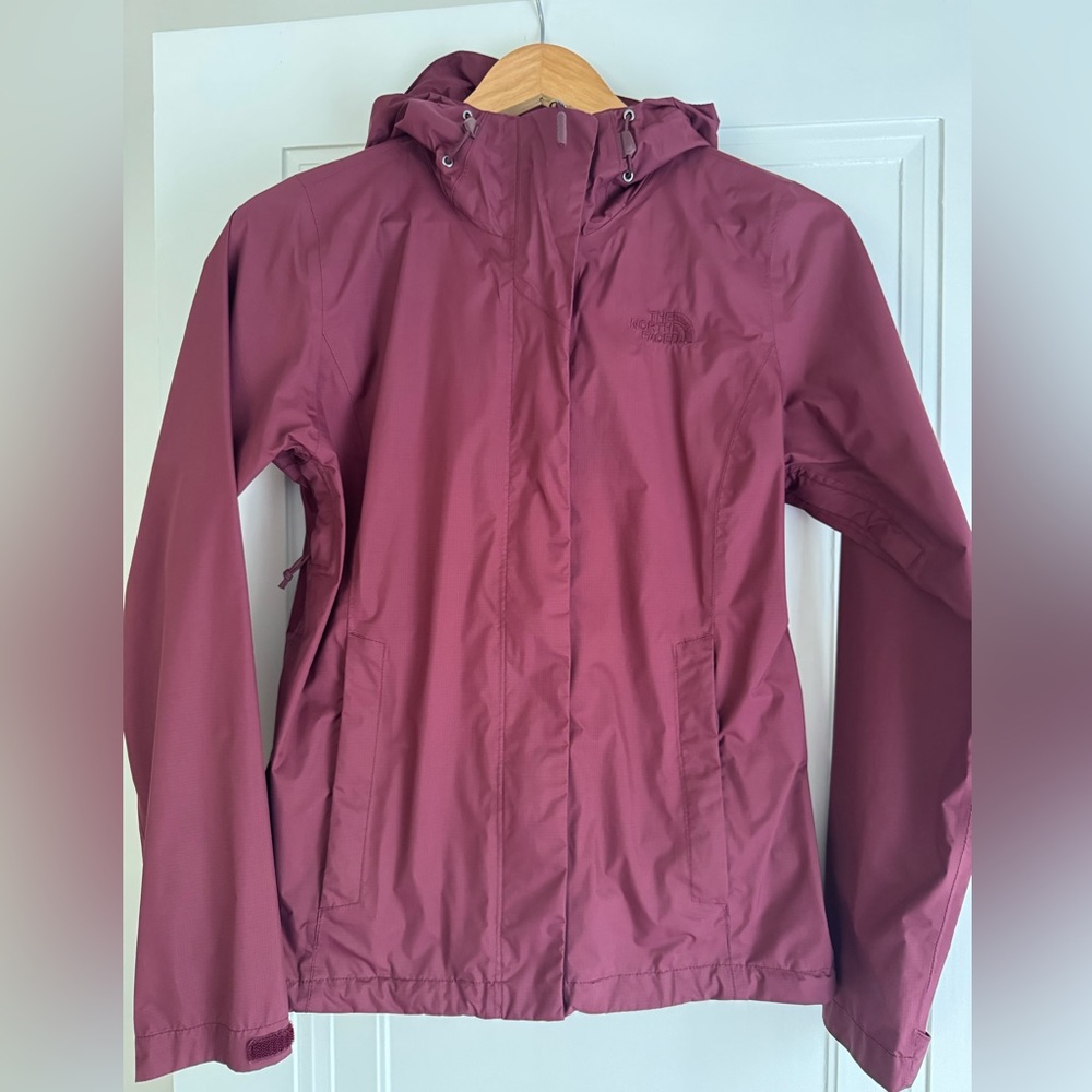 North Face waterproof rain shell with pit zips and hood.